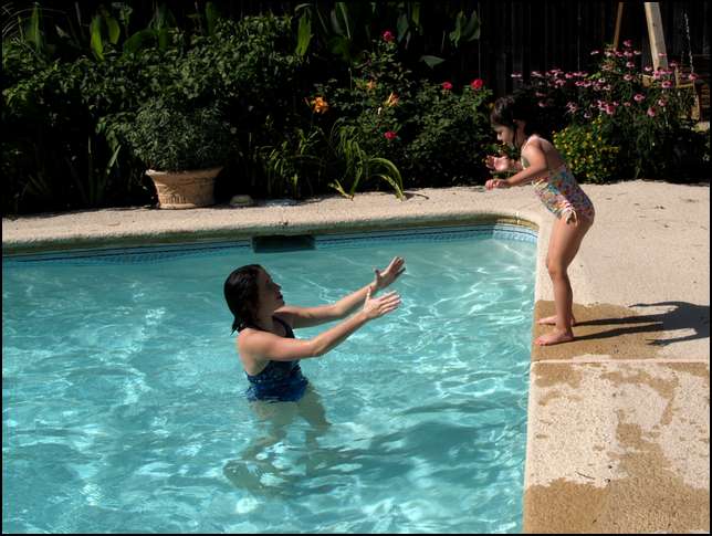 Practicing jumping into the pool with Laura