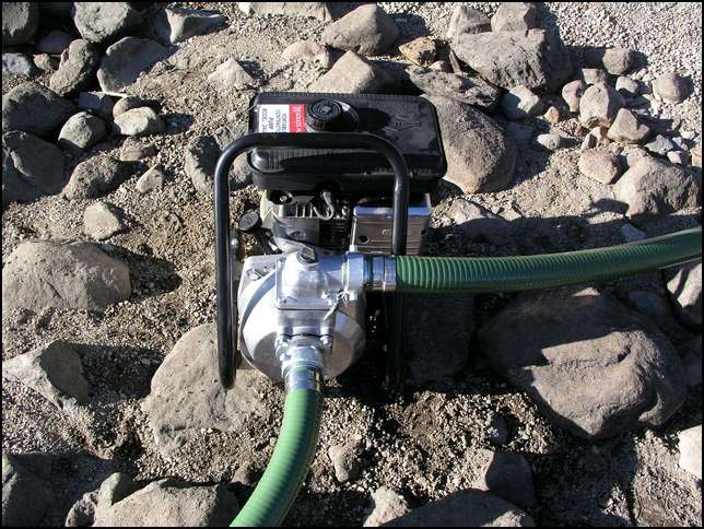 Booster pump front is the 15 foot intake hose and to the right the discharge hose
