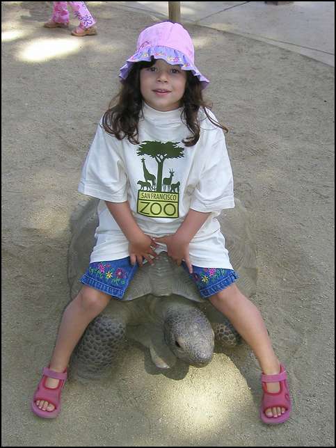 Sydney riding a turtle