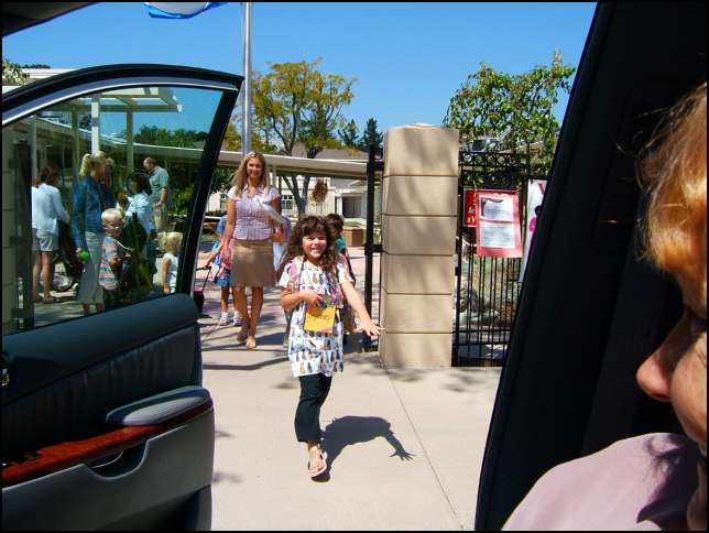 Miss Tyler escorts the kids to the Flagpool and watching Sydney get safely into the van