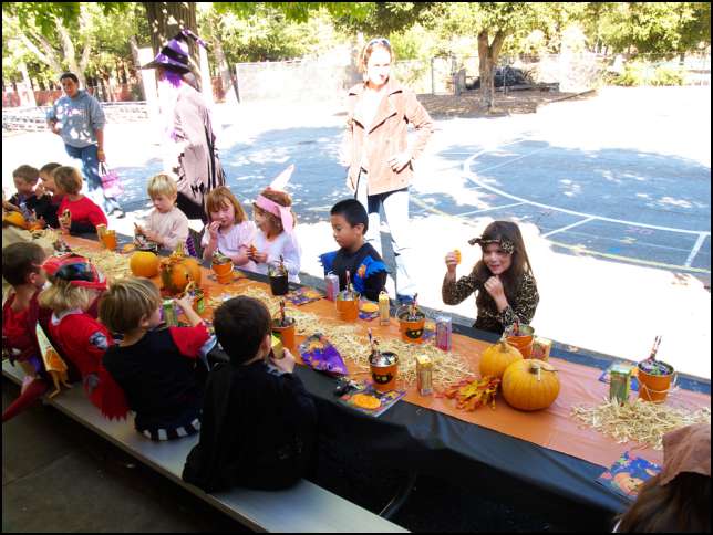 Sydney with her class mates enjoying a halloween snack after the parade