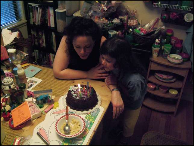 Linda's getting a little help from Sydney in blowing out the candles