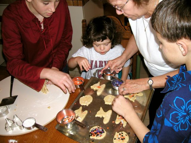 It's fun to bake cookies with Grandma, Laura, and Craig